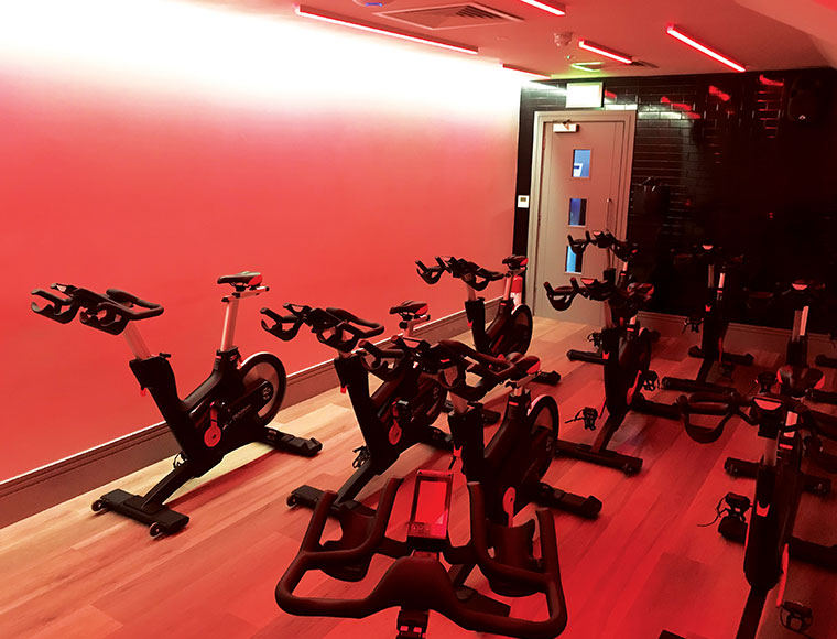 Spin bike ceiling red lighting