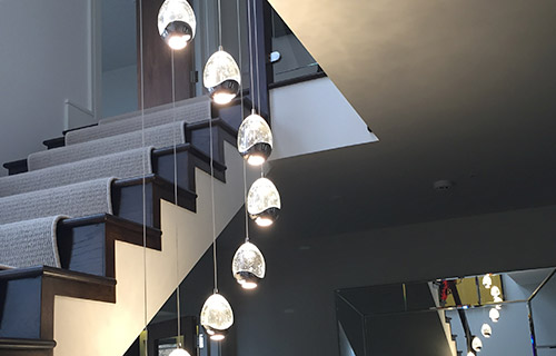 droplet glass chandelier in modern stairwell